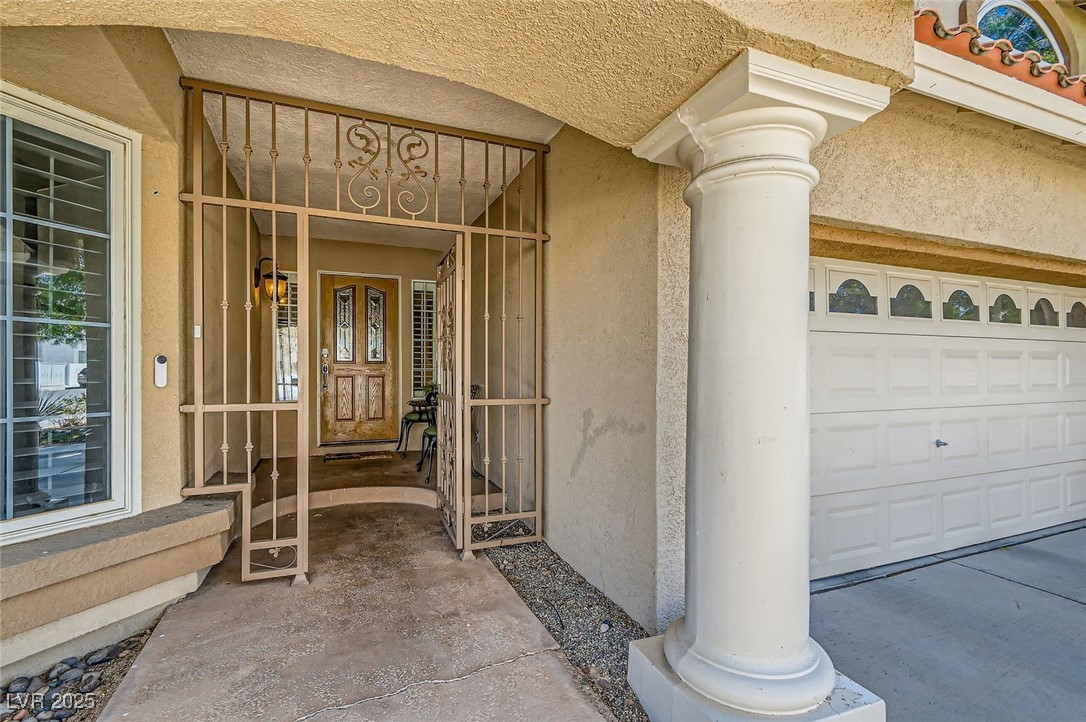 20 High Sierra Henderson, NV 89074 - Photo 6 of 53 Doorway to property featuring stucco siding and a garage