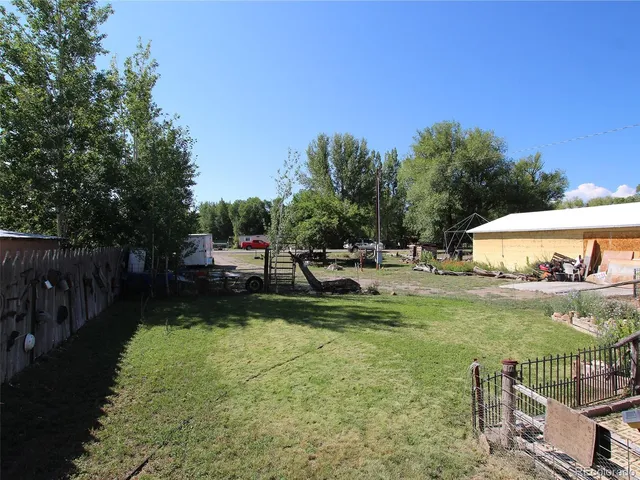 a view of a garden with patio