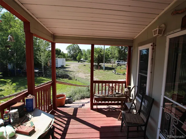 a view of a patio with a dining table and chairs