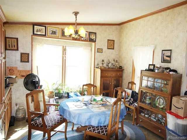 a dining room with furniture a rug and wooden floor