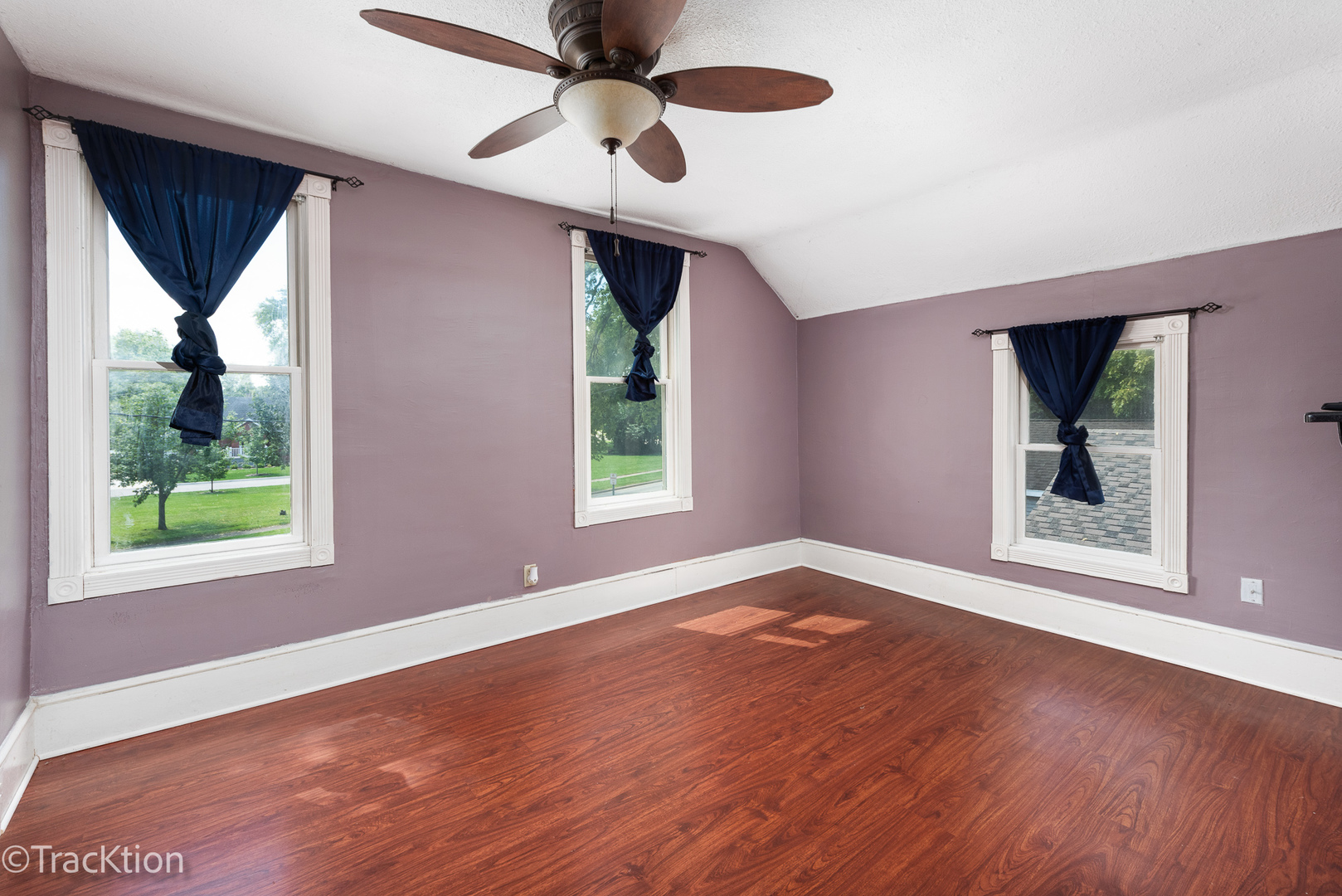 316 East Division Street Lockport, IL 60441 - Photo 11 of 19 a view of an empty room with wooden floor and a window