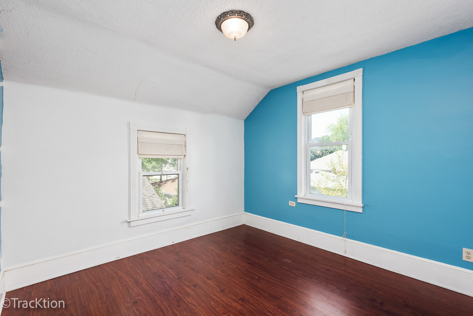 316 East Division Street Lockport, IL 60441 - Photo 15 of 19 an empty room with wooden floor and windows