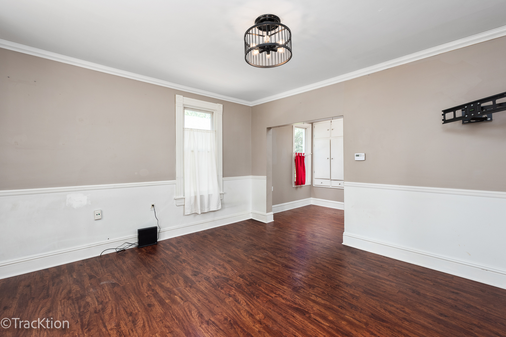 316 East Division Street Lockport, IL 60441 - Photo 4 of 19 an empty room with wooden floor and window