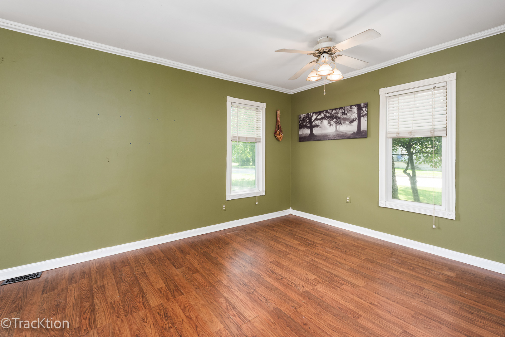 316 East Division Street Lockport, IL 60441 - Photo 9 of 19 a view of an empty room with a window and wooden floor
