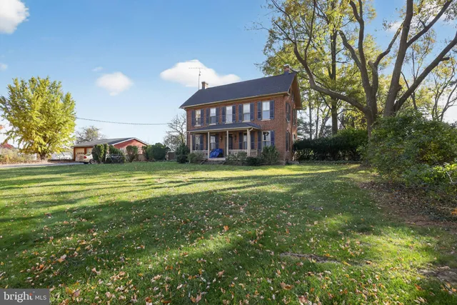 a view of a house with a big yard