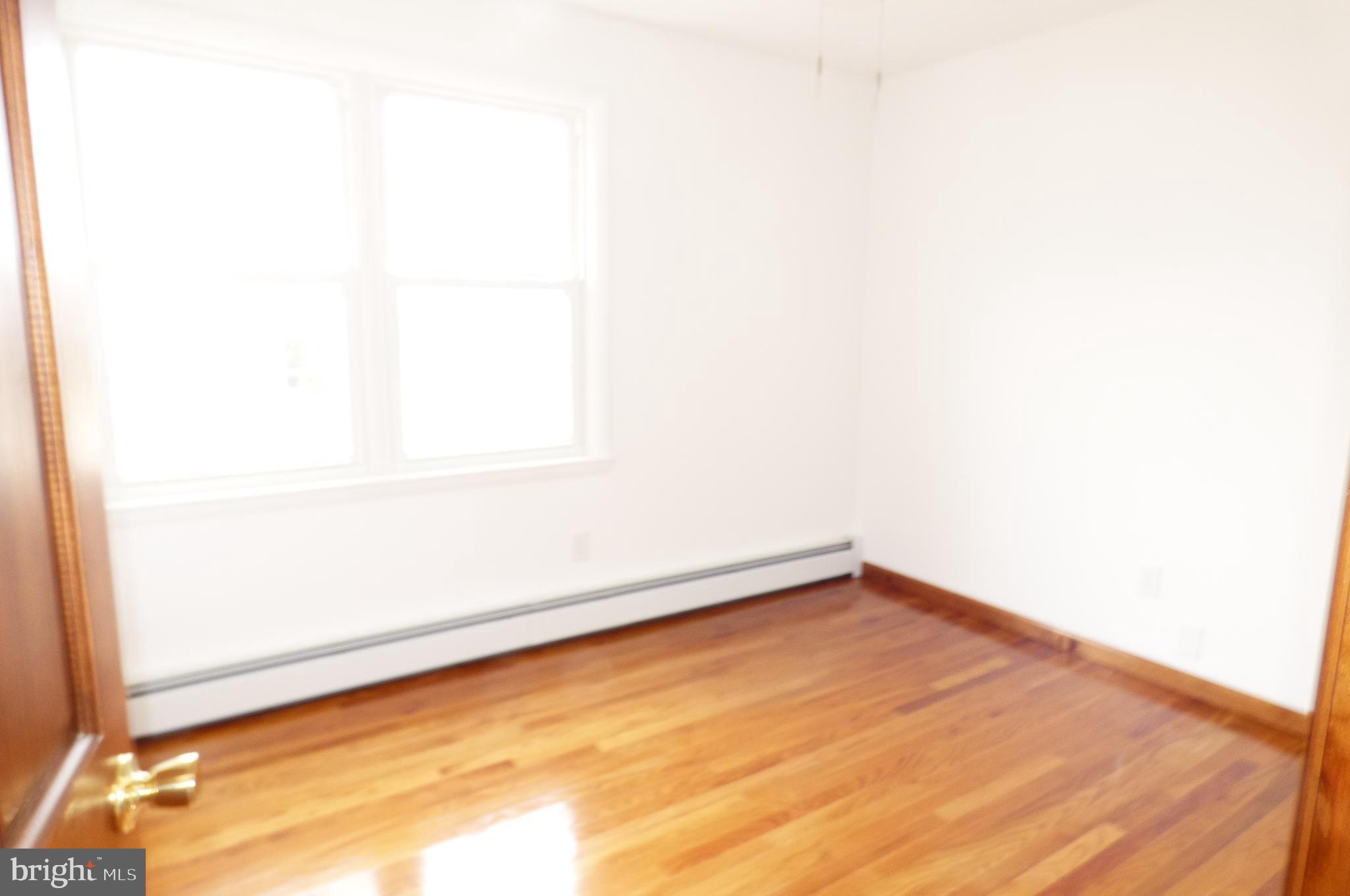 151 Washington Street Red Hill, PA 18076 - Photo 17 of 20 a view of a small space with wooden floor and a window