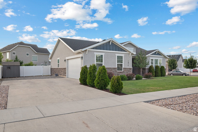1074 South 750 West Springville, UT 84663 - Photo 2 of 28 Contemporary single-story residence featuring a stone and stucco facade