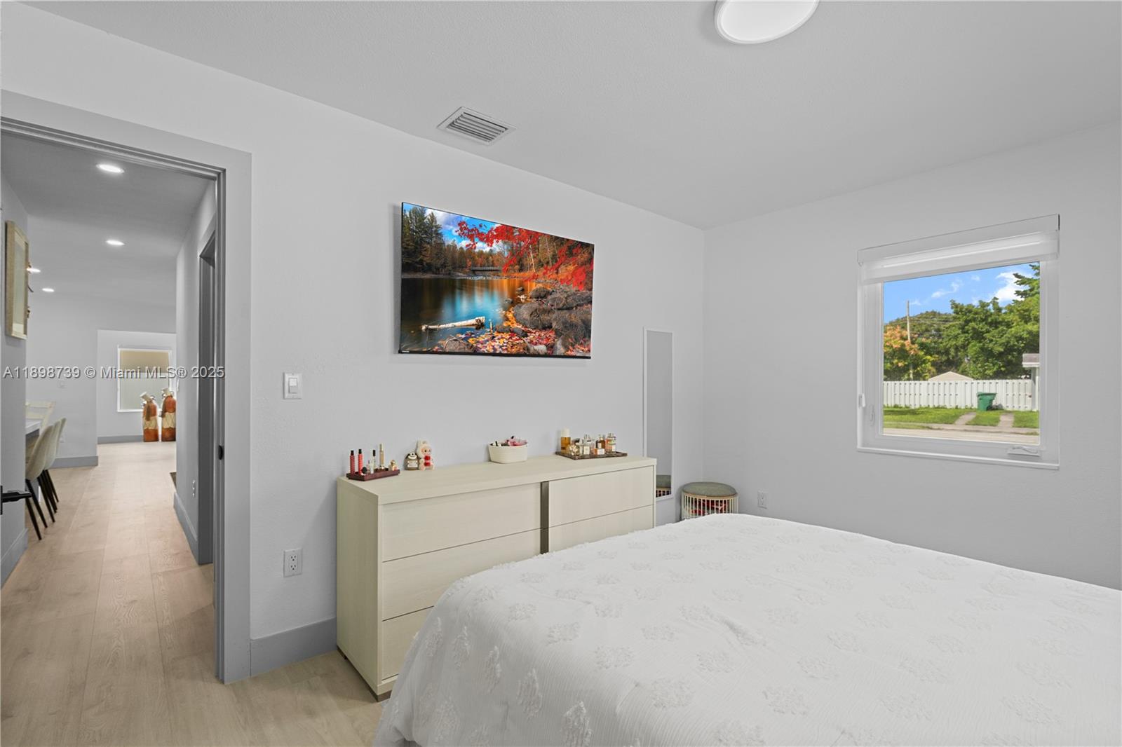 11350 Southwest 57th Street Miami, FL 33173 - Photo 13 of 47 a bedroom with a bed and a flat screen tv