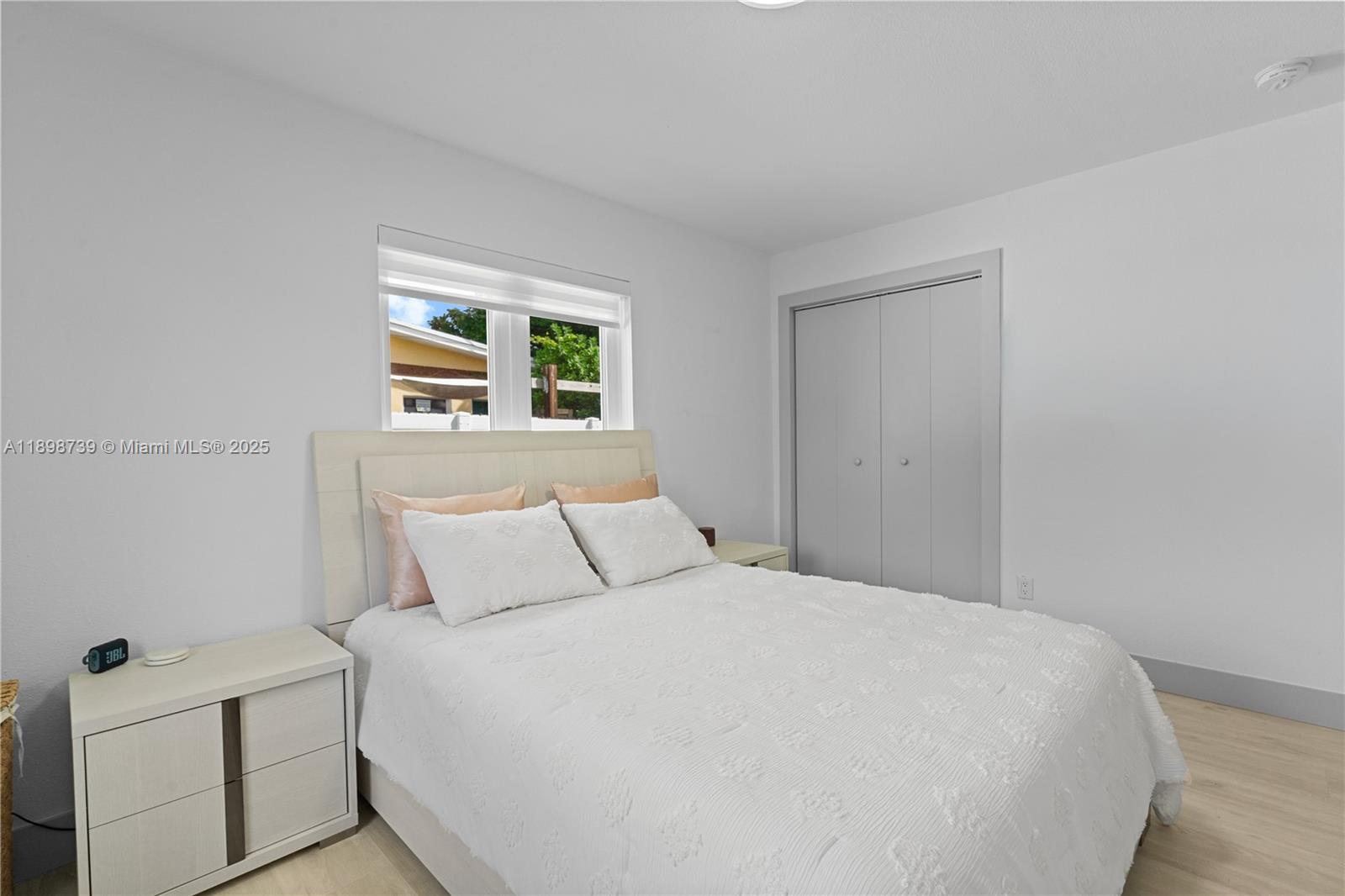 11350 Southwest 57th Street Miami, FL 33173 - Photo 14 of 47 a bedroom with a bed and a window