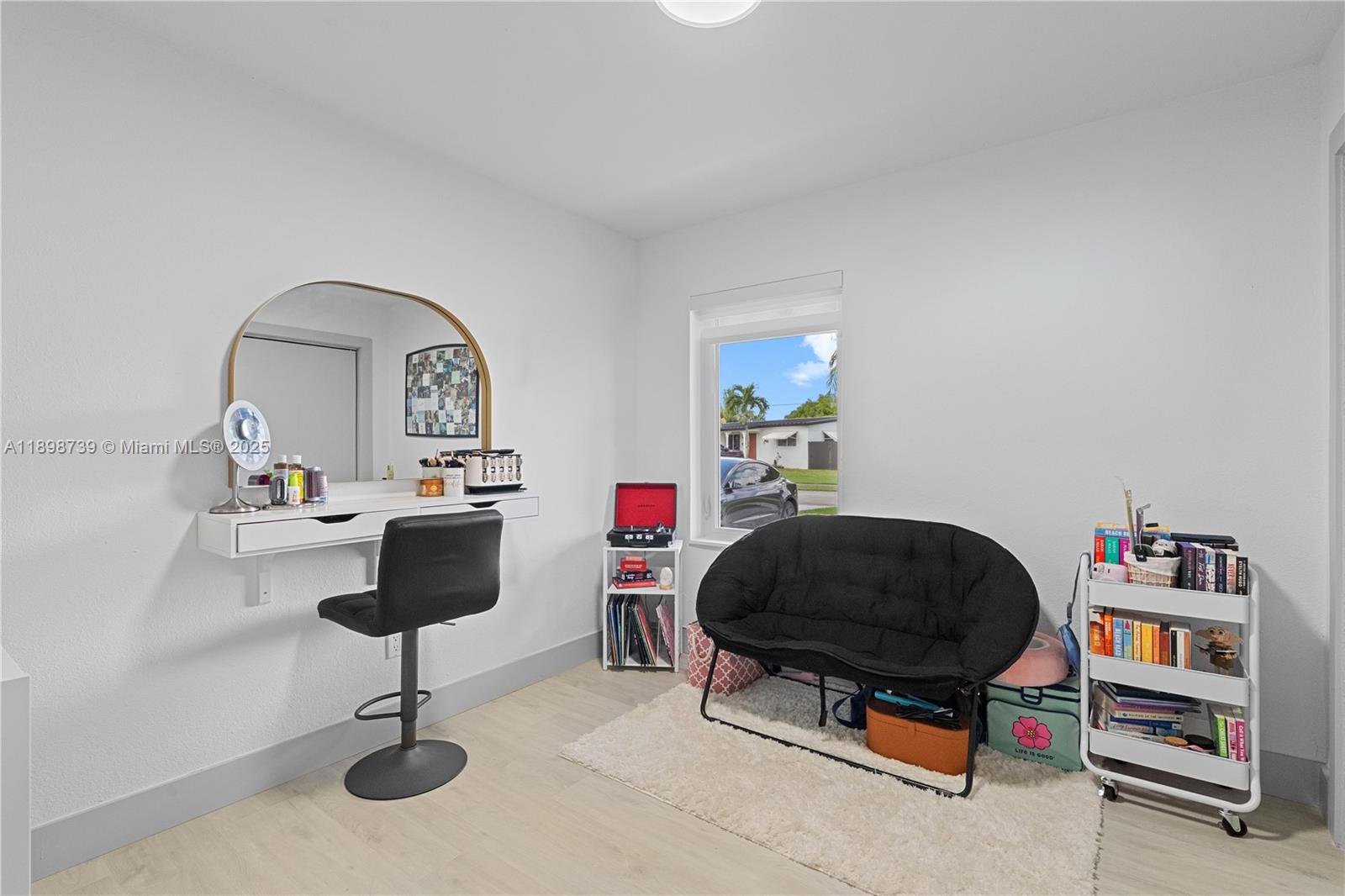 11350 Southwest 57th Street Miami, FL 33173 - Photo 18 of 47 a living room with furniture and a painting on the wall