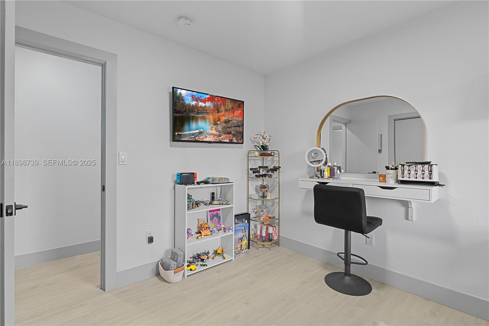 11350 Southwest 57th Street Miami, FL 33173 - Photo 19 of 47 a living room with furniture and a flat screen tv