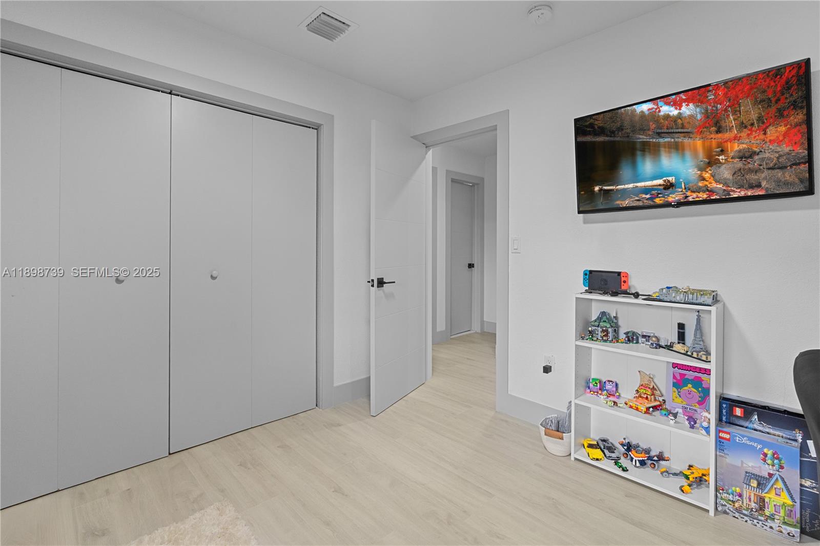 11350 Southwest 57th Street Miami, FL 33173 - Photo 20 of 47 a room with toys and flat screen tv