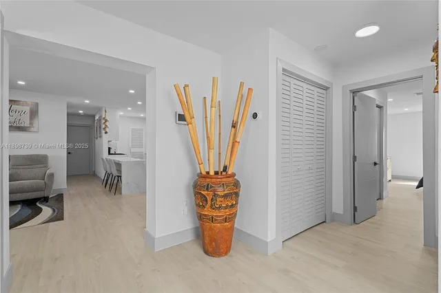 a view of a hallway with seating area