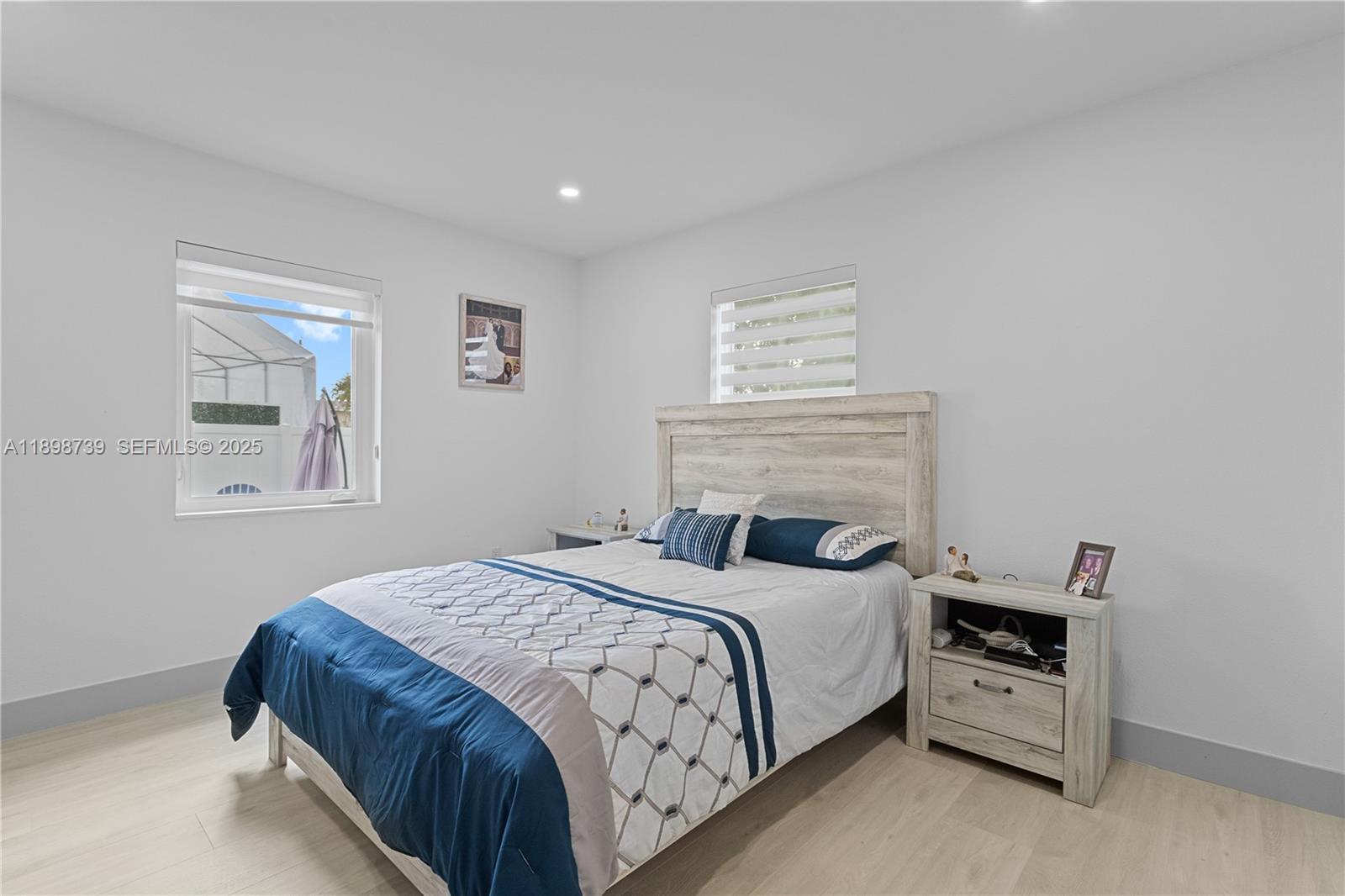 11350 Southwest 57th Street Miami, FL 33173 - Photo 27 of 47 a bedroom with a bed and a window