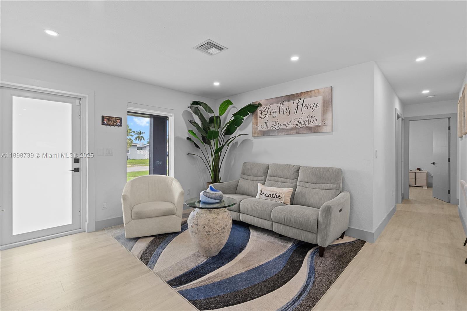 11350 Southwest 57th Street Miami, FL 33173 - Photo 3 of 47 a living room with furniture and a potted plant