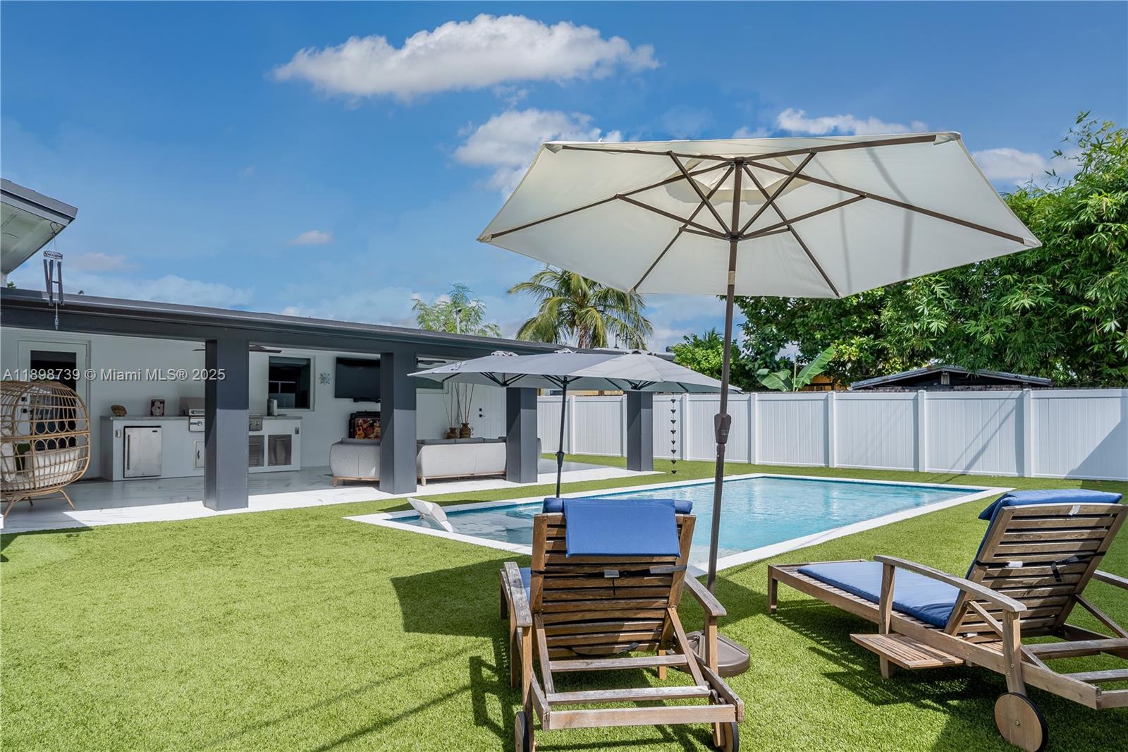 11350 Southwest 57th Street Miami, FL 33173 - Photo 36 of 47 a view of a house with swimming pool and sitting area