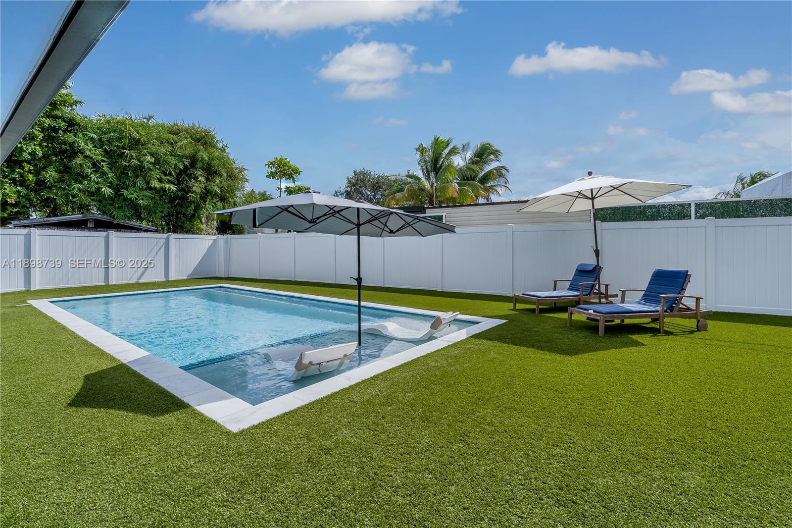 11350 Southwest 57th Street Miami, FL 33173 - Photo 38 of 47 an outdoor space with swimming pool and furniture