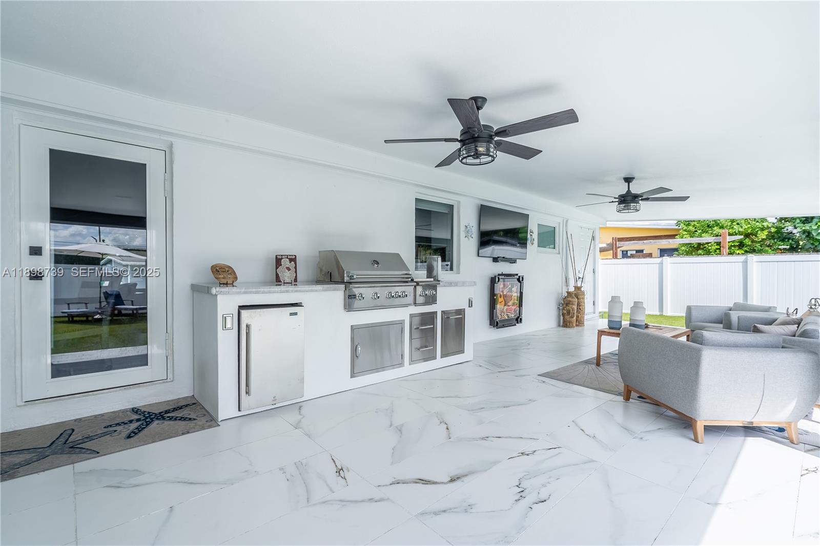 11350 Southwest 57th Street Miami, FL 33173 - Photo 42 of 47 a view of a kitchen with furniture and a window