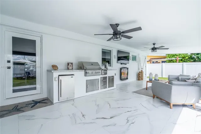a view of a kitchen with furniture and a window