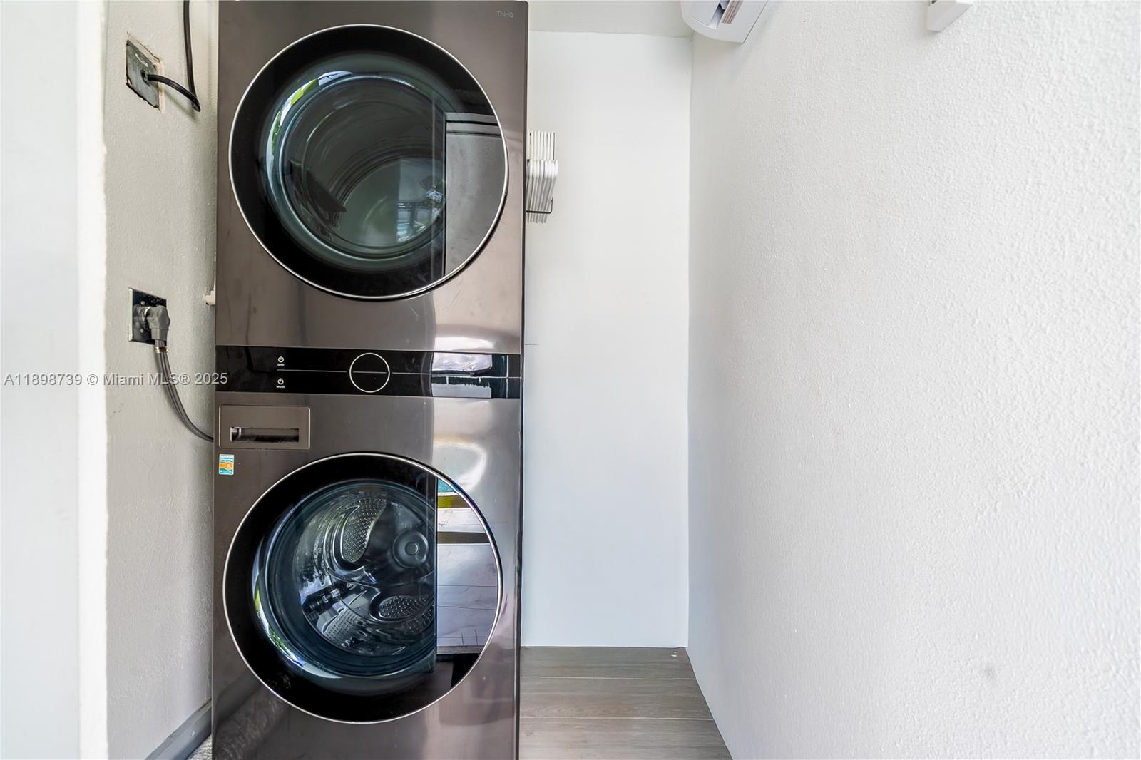 11350 Southwest 57th Street Miami, FL 33173 - Photo 43 of 47 a close up view of a washer and dryer