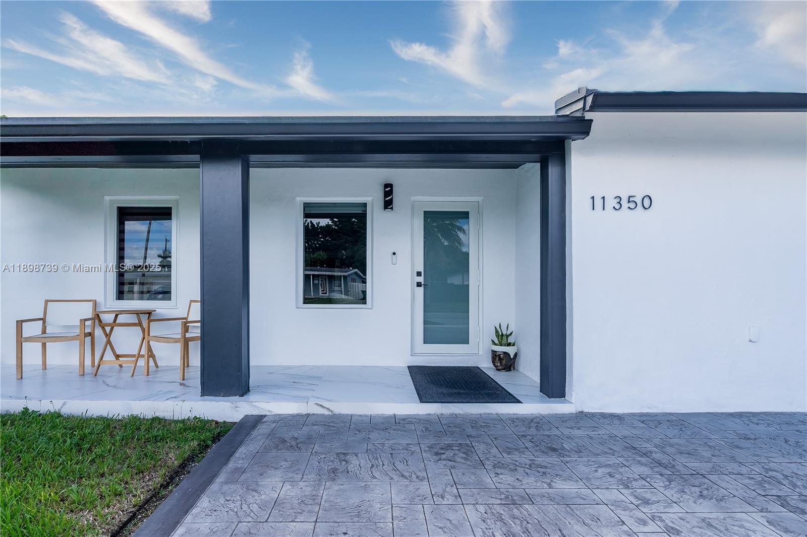 11350 Southwest 57th Street Miami, FL 33173 - Photo 47 of 47 a view of a porch with a table and chairs