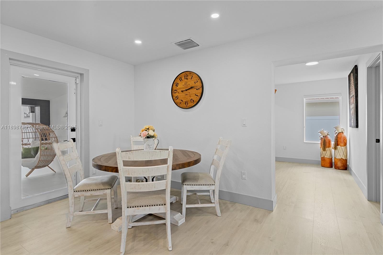 11350 Southwest 57th Street Miami, FL 33173 - Photo 6 of 47 a view of a dining room with furniture and a table