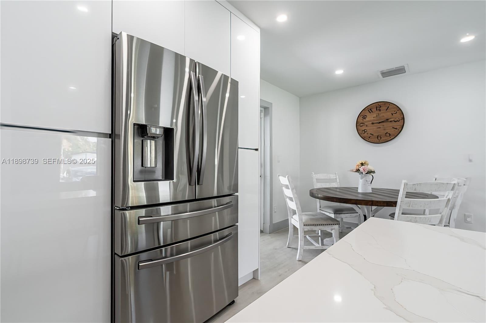 11350 Southwest 57th Street Miami, FL 33173 - Photo 8 of 47 a kitchen with a refrigerator and a sink