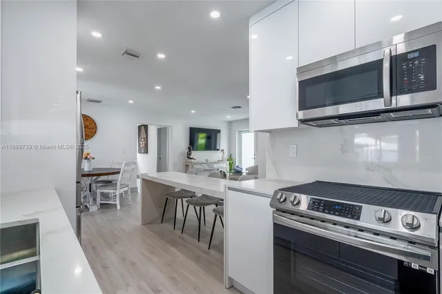 a kitchen with a stove and a microwave