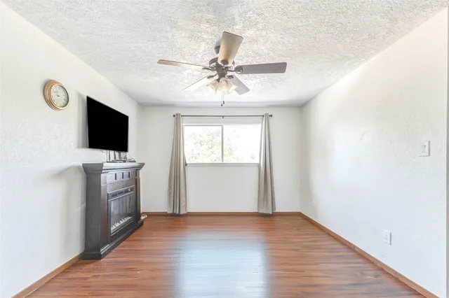 a view of a kitchen with microwave and cabinets