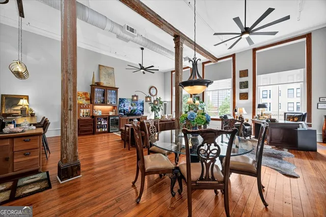 a view of a dining room with furniture window and wooden floor