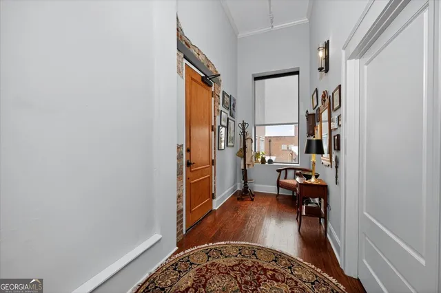 a living room with furniture and a rug