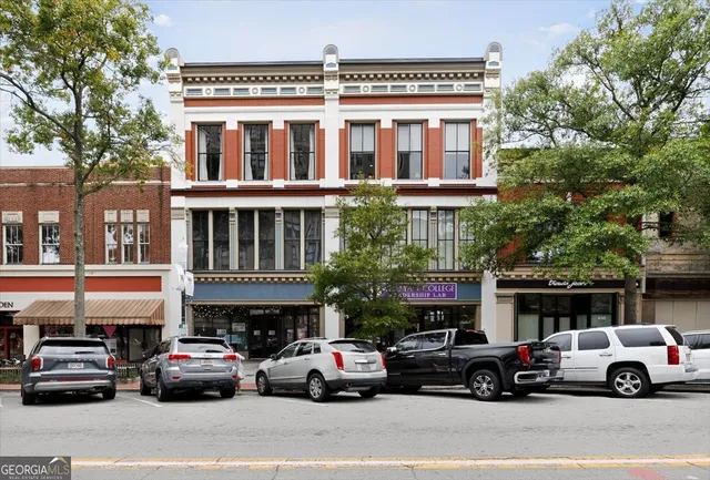a view of a cars parked in front of a building