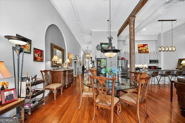 a living room with lots of furniture and a chandelier