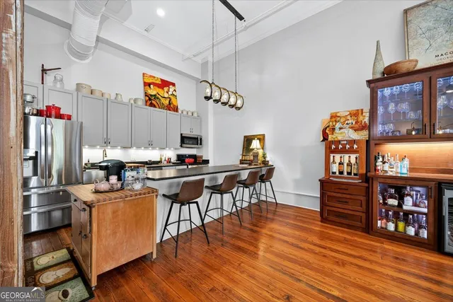 a kitchen with stainless steel appliances granite countertop a stove and refrigerator