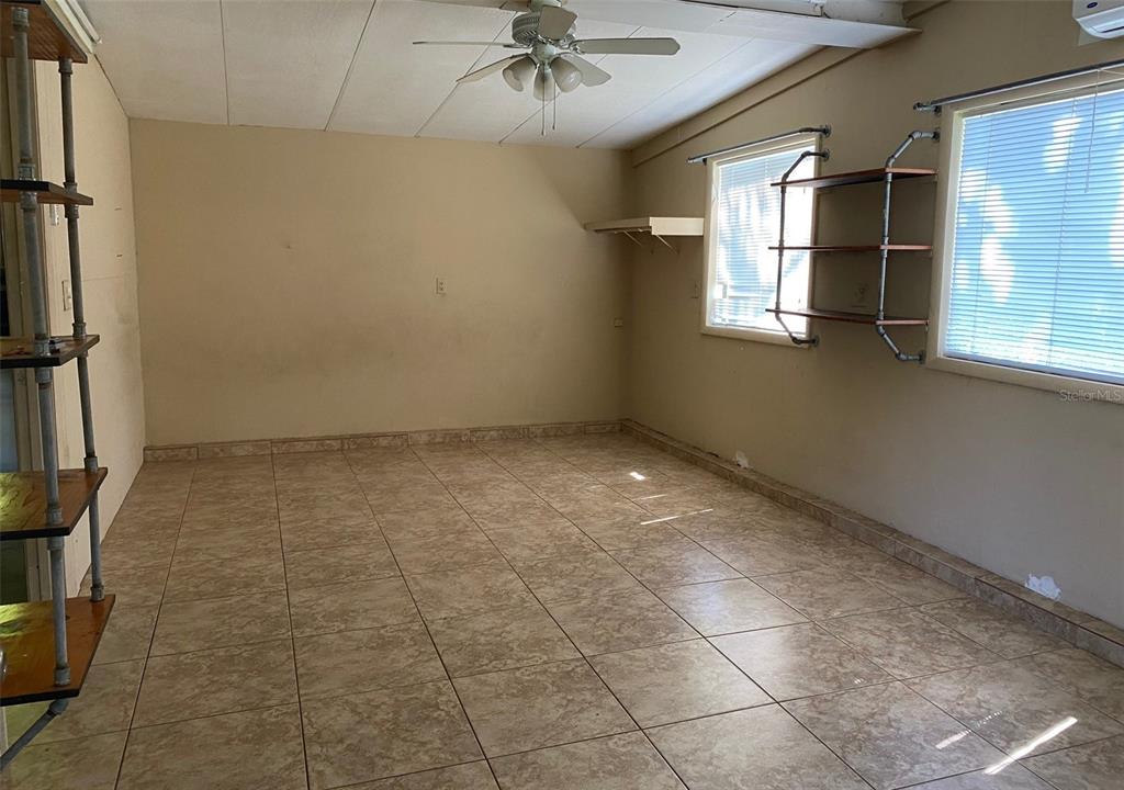 1626 Roosevelt Avenue, Unit C Orlando, FL 32804 - Photo 3 of 6 a view of an empty room with a window