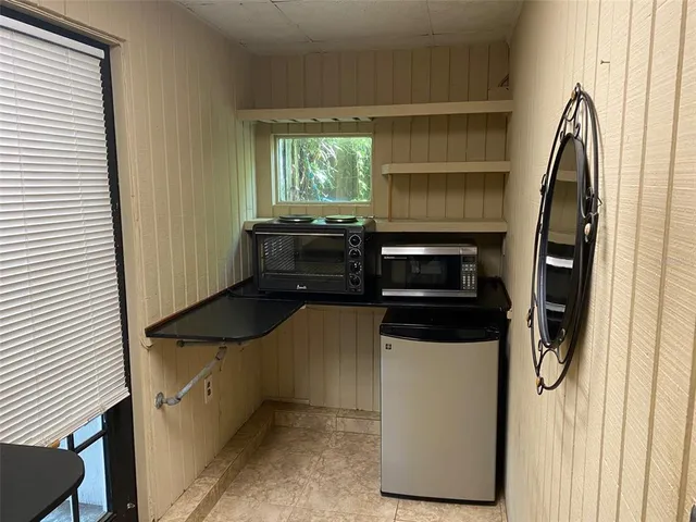 a kitchen with a stove and a microwave