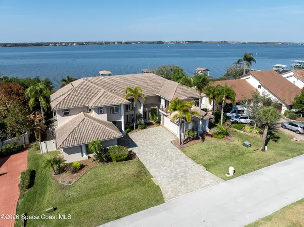 an aerial view of a house with a garden