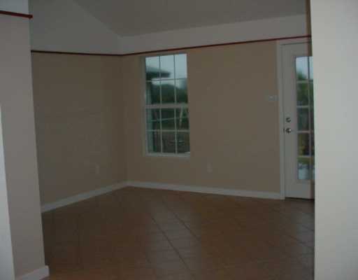 1929 Sandy Way Corpus Christi, TX 78418 - Photo 2 of 7 an empty room with a window