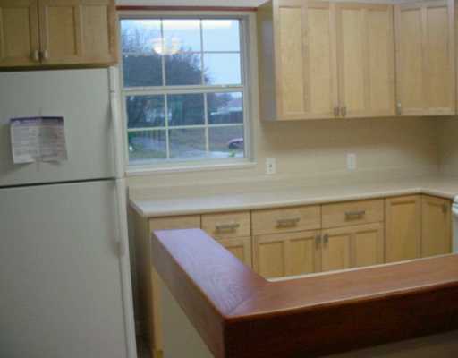 1929 Sandy Way Corpus Christi, TX 78418 - Photo 3 of 7 a kitchen with a sink and cabinets