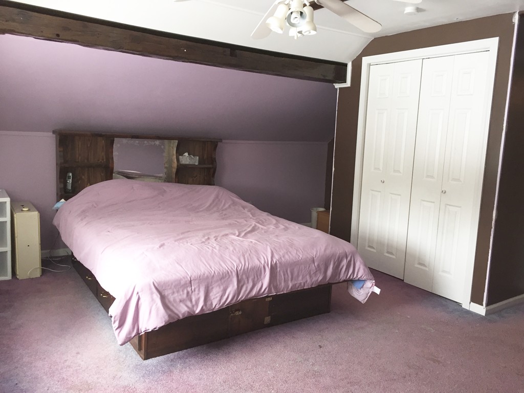 46 Smith Street Palmer, MA 01069 - Photo 12 of 17 a bedroom with a bed and a mirror