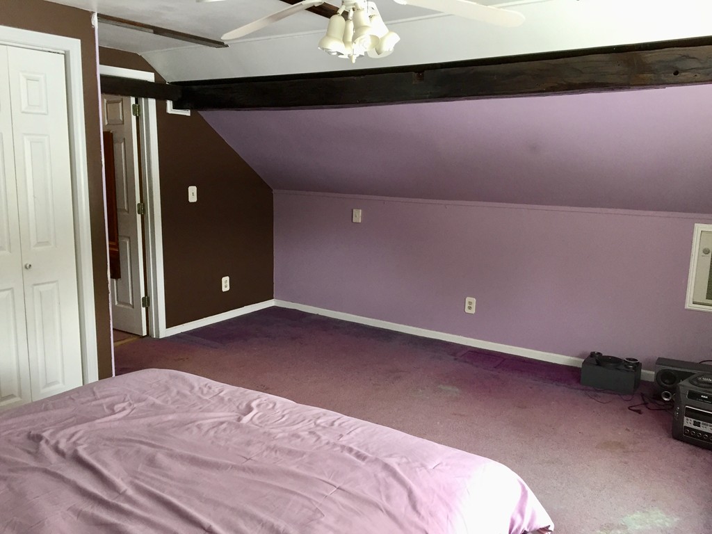 46 Smith Street Palmer, MA 01069 - Photo 13 of 17 a bedroom with a bed and a chandelier