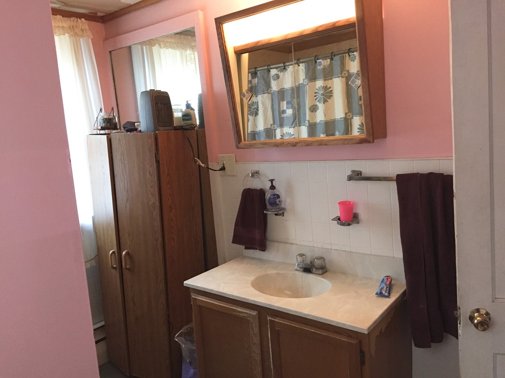 46 Smith Street Palmer, MA 01069 - Photo 14 of 17 a bathroom with a sink and a mirror