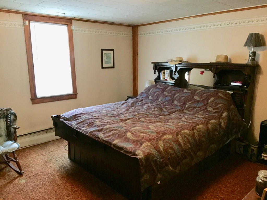 46 Smith Street Palmer, MA 01069 - Photo 16 of 17 a bedroom with a bed and window