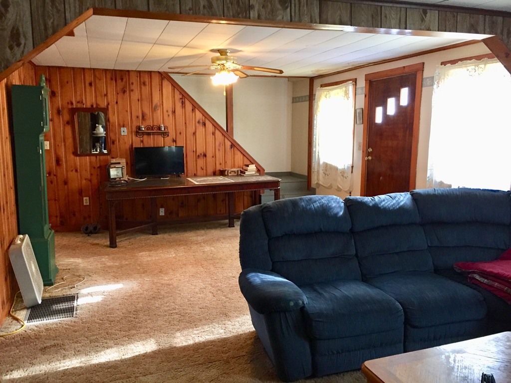 46 Smith Street Palmer, MA 01069 - Photo 8 of 17 a living room with furniture and a flat screen tv