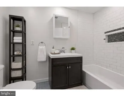 a bathroom with a sink and a bathtub