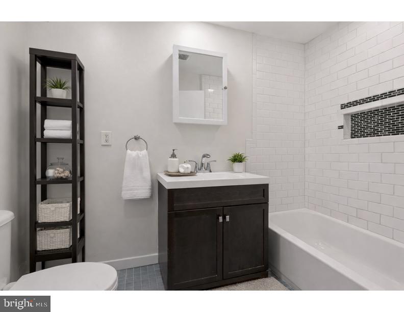 1840 North Taylor Street Philadelphia, PA 19121 - Photo 15 of 29 a bathroom with a sink and a bathtub