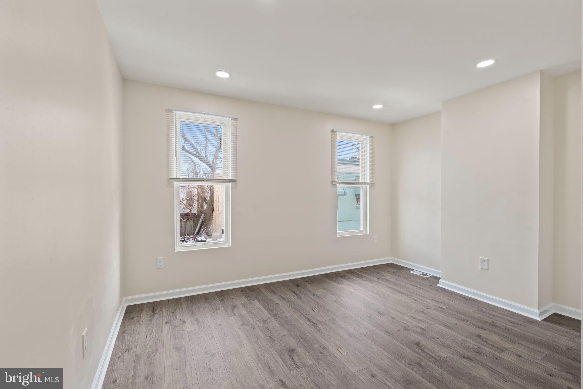 1840 North Taylor Street Philadelphia, PA 19121 - Photo 21 of 29 an empty room with wooden floor and windows