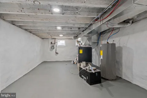 a view of a house with wooden fence