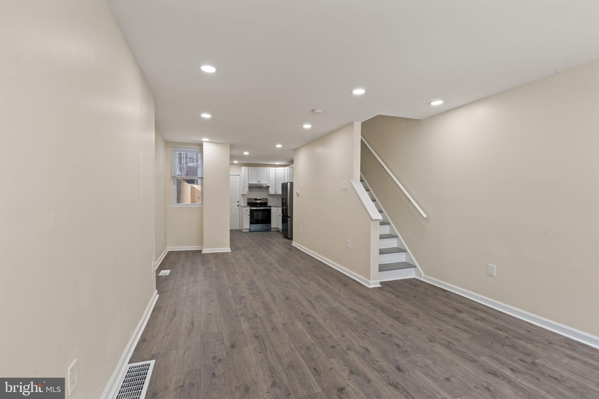 1840 North Taylor Street Philadelphia, PA 19121 - Photo 4 of 29 a view of a hallway with wooden floor and staircase