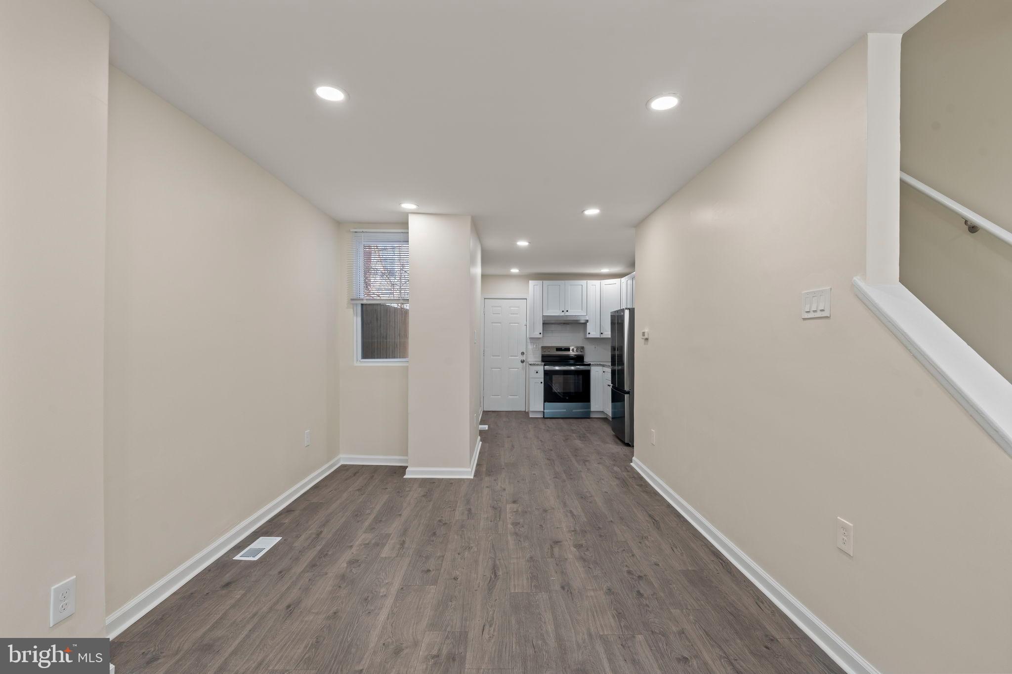 1840 North Taylor Street Philadelphia, PA 19121 - Photo 5 of 29 a view of a kitchen with a sink and a refrigerator